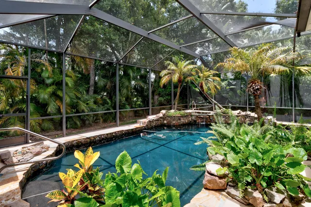 a view of a swimming pool with a patio