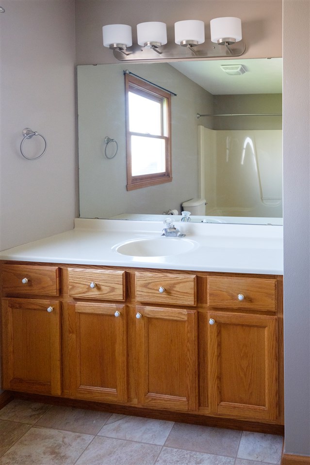 5378 Torque Road Loves Park, IL 61111 - Photo 11 of 24 a bathroom with a sink and a mirror