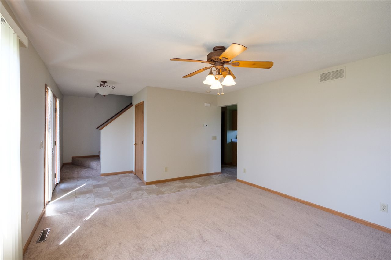 5378 Torque Road Loves Park, IL 61111 - Photo 4 of 24 an empty room with a chandelier fan and closet