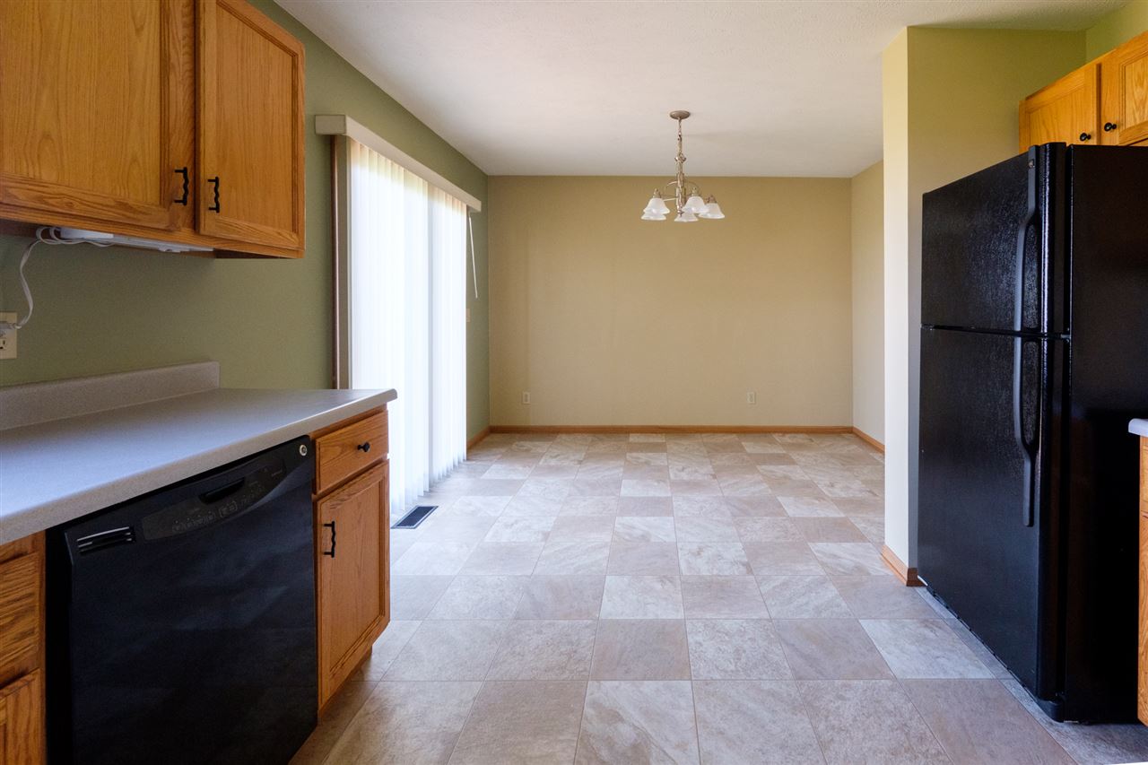 5378 Torque Road Loves Park, IL 61111 - Photo 7 of 24 a view of kitchen with a refrigerator cabinets and a sink