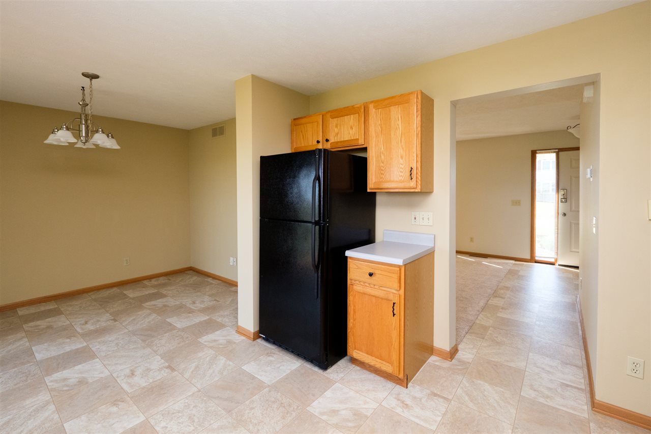 5378 Torque Road Loves Park, IL 61111 - Photo 8 of 24 a kitchen with a refrigerator and cabinets