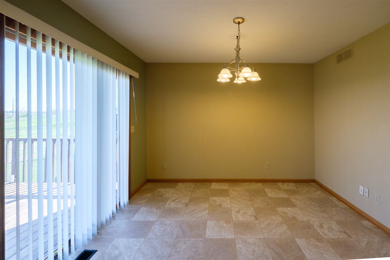 5378 Torque Road Loves Park, IL 61111 - Photo 9 of 24 a view of a chandelier fan and hardwood floor