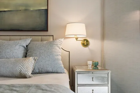 a living room with a couch and dresser