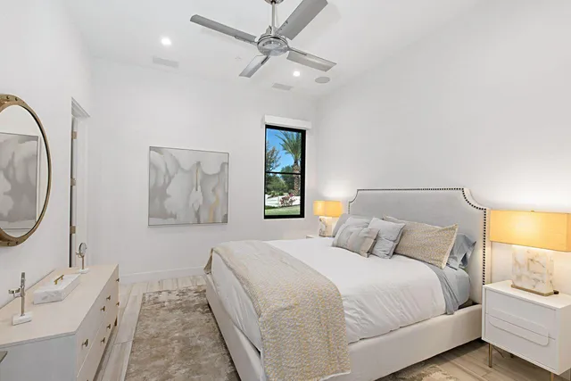 a bathroom with a sink mirror and toilet