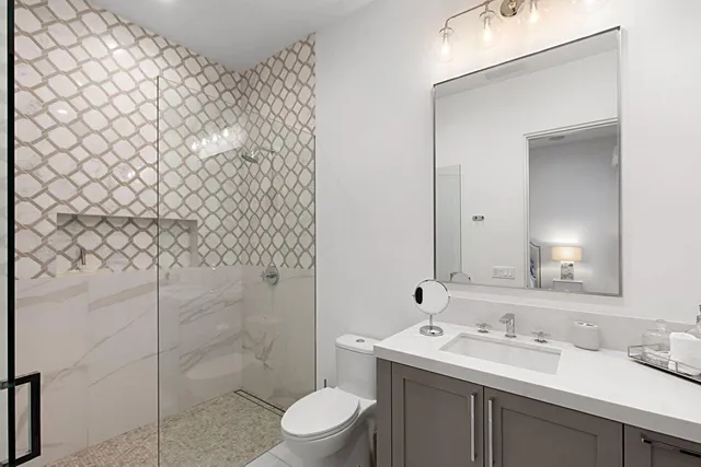 a living room with a bed furniture and a large window