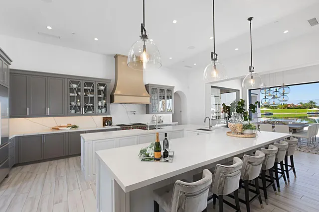 a large kitchen with a table and chairs
