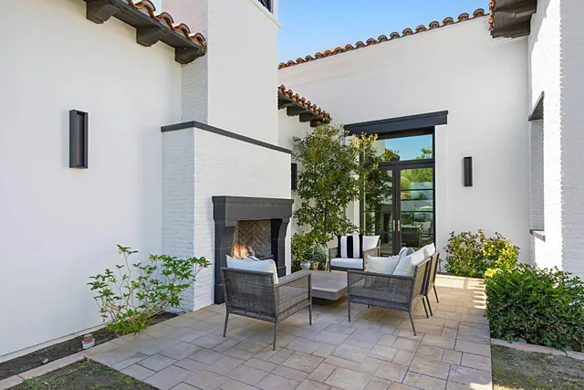 a view of a swimming pool and lounge chairs