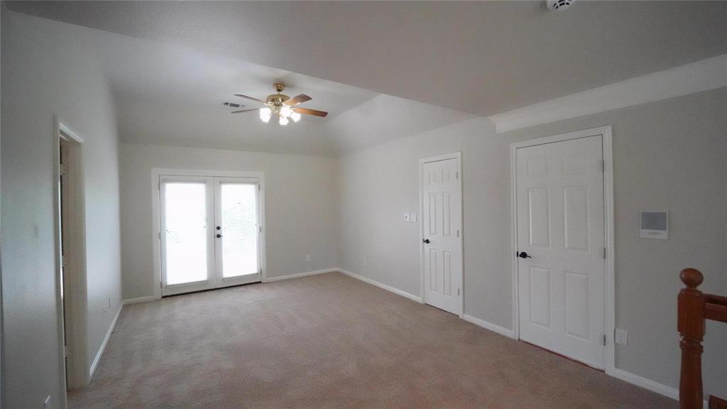 3718 Cliff View Loop Weatherford, TX 76087 - Photo 12 of 24 a view of a room with a ceiling fan and a window