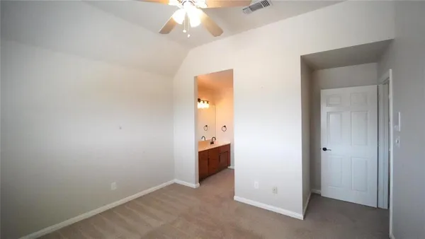 an empty room with a bathroom