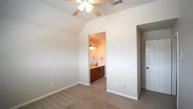 an empty room with a bathroom