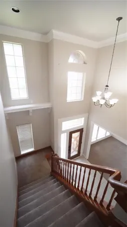 a view of a livingroom with wooden floor and a window