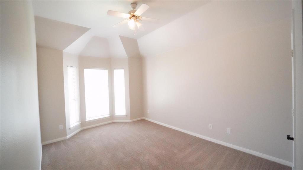 3718 Cliff View Loop Weatherford, TX 76087 - Photo 20 of 24 an empty room with a window and a fan