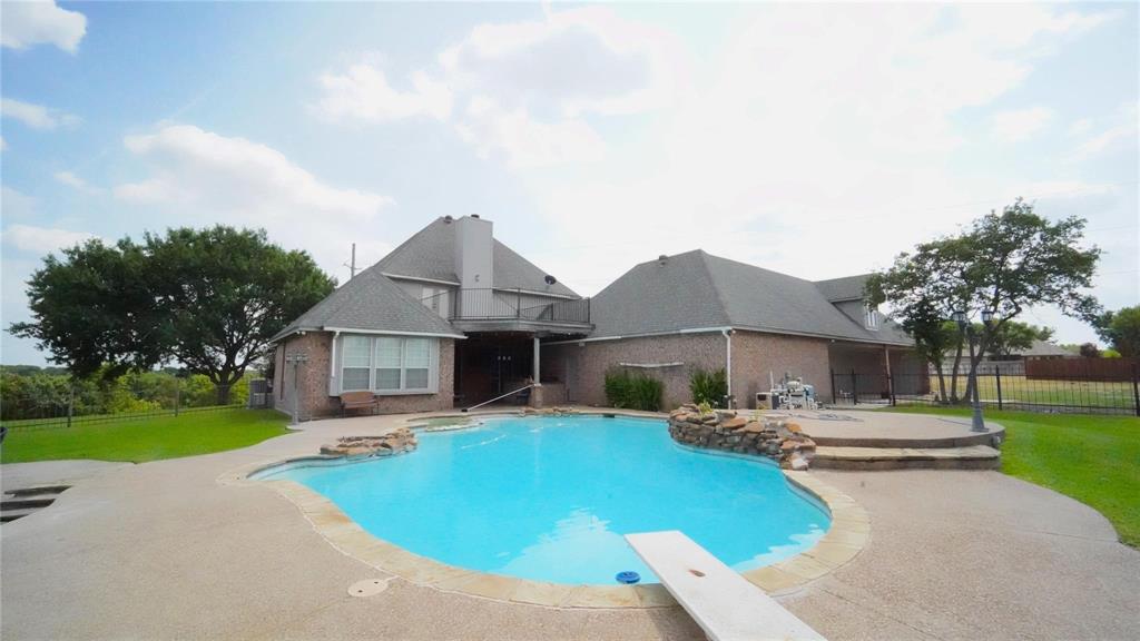 3718 Cliff View Loop Weatherford, TX 76087 - Photo 24 of 24 a front view of house with yard and trees in the background