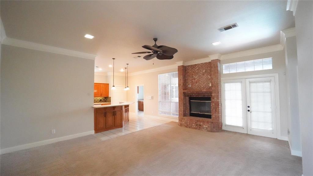 3718 Cliff View Loop Weatherford, TX 76087 - Photo 5 of 24 an empty room with kitchen and a fireplace