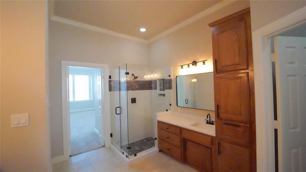 3718 Cliff View Loop Weatherford, TX 76087 - Photo 10 of 24 a bathroom with a double vanity sink and a mirror