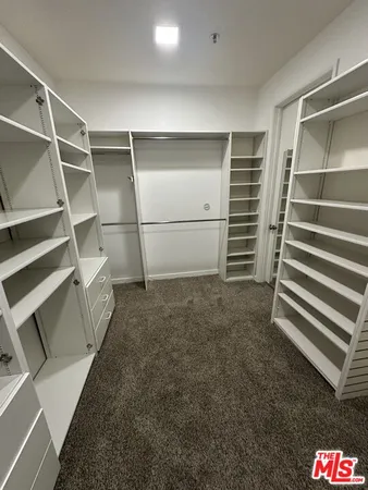 front view of a house with a garden