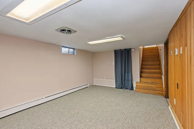 a view of an empty room with stairs