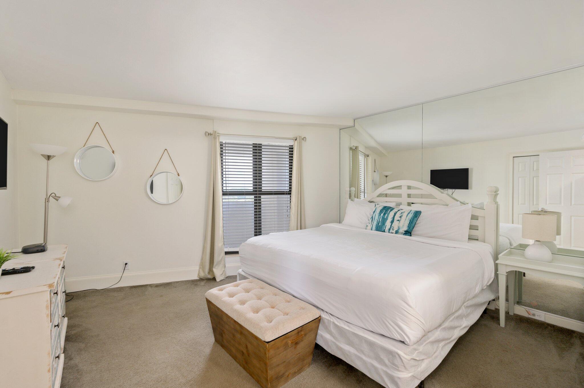 4277 Beachside 2, Unit 4277 Miramar Beach, FL 32550 - Photo 12 of 71 a bedroom with a bed a couch and dresser