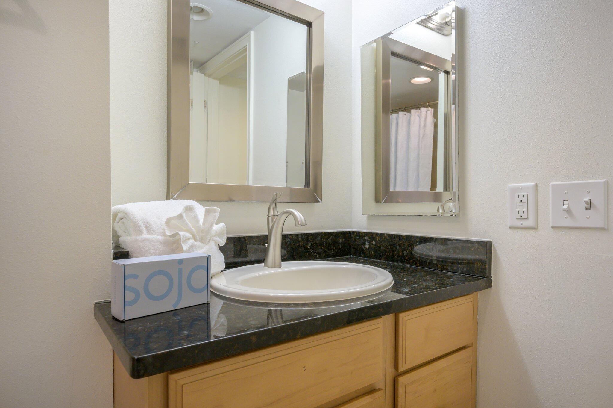 4277 Beachside 2, Unit 4277 Miramar Beach, FL 32550 - Photo 15 of 71 a bathroom with a granite countertop sink and a mirror