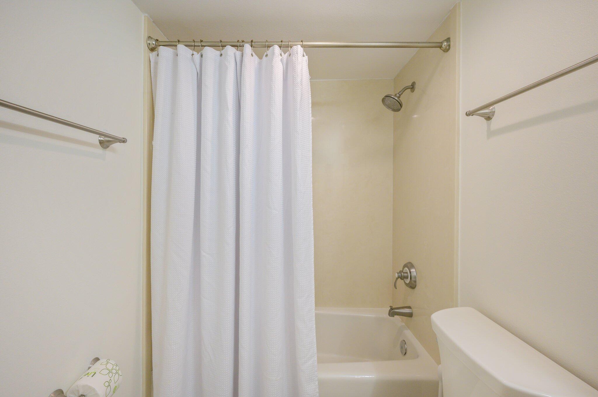4277 Beachside 2, Unit 4277 Miramar Beach, FL 32550 - Photo 16 of 71 a bathroom with a shower curtain and a bath tub