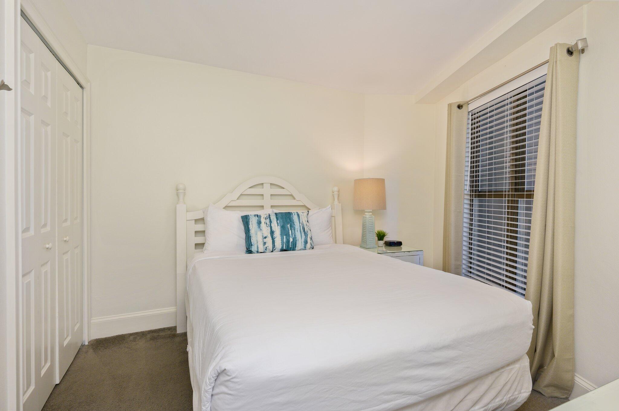 4277 Beachside 2, Unit 4277 Miramar Beach, FL 32550 - Photo 18 of 71 a bedroom with a large bed and a window