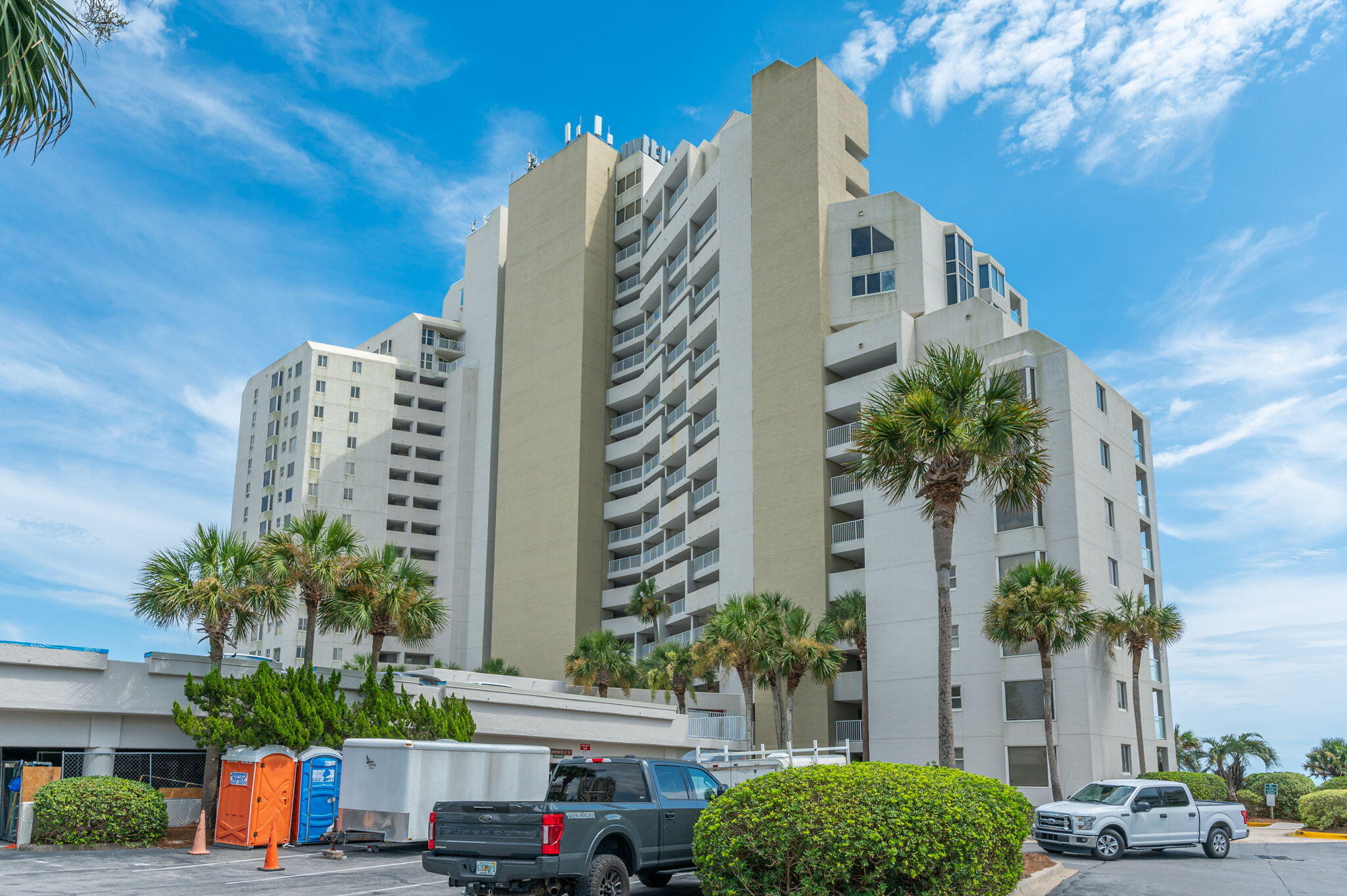4277 Beachside 2, Unit 4277 Miramar Beach, FL 32550 - Photo 30 of 71 a front view of multi story residential apartment building with yard and car parked