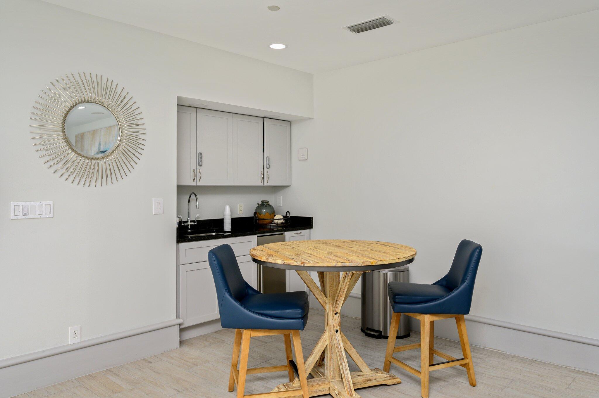 4277 Beachside 2, Unit 4277 Miramar Beach, FL 32550 - Photo 34 of 71 a table and chairs in a room