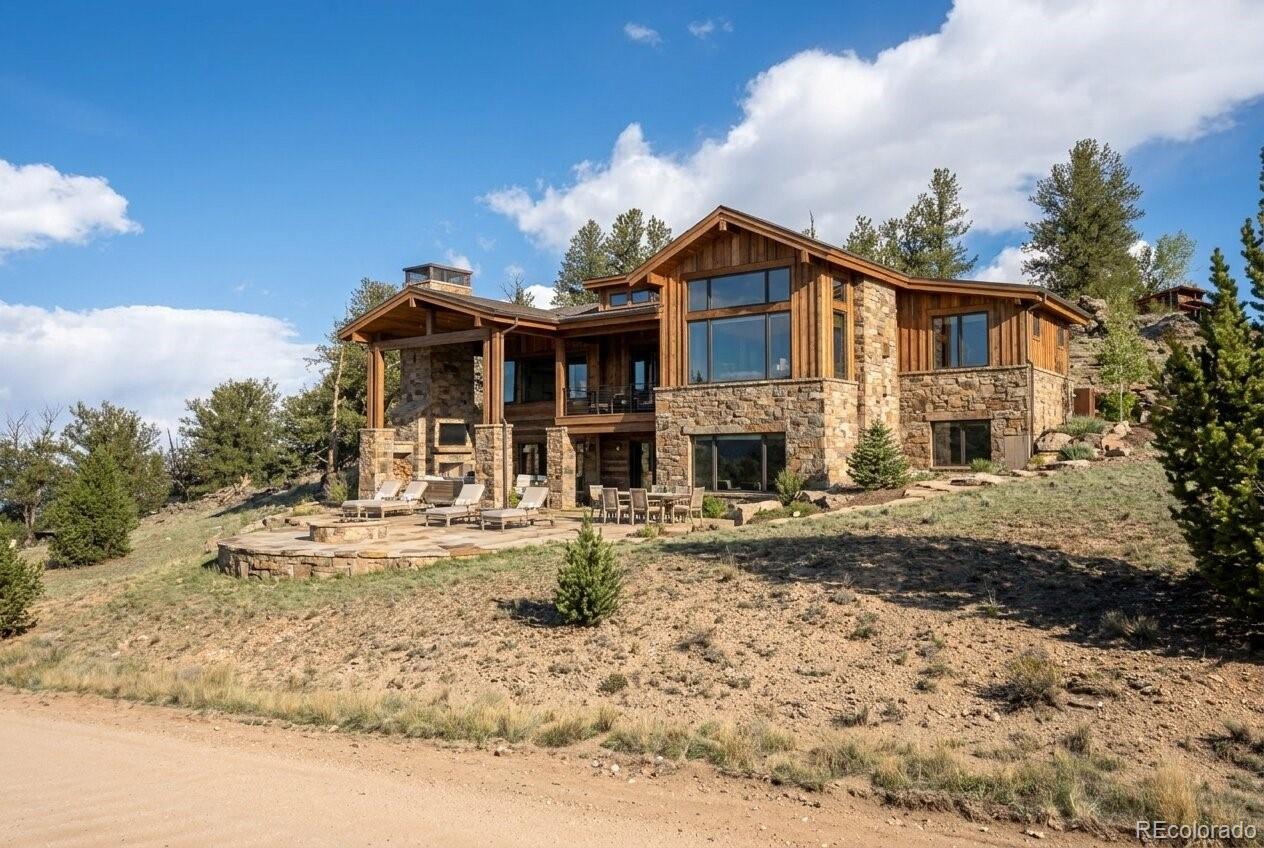 4484 Remington Road Jefferson, CO 80456 - Photo 15 of 17 a front view of a house with a yard