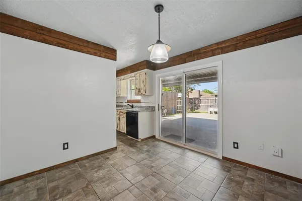 a view of a kitchen with an oven and cabinets