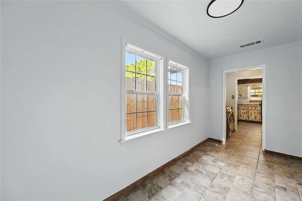 a view of an empty room with a window
