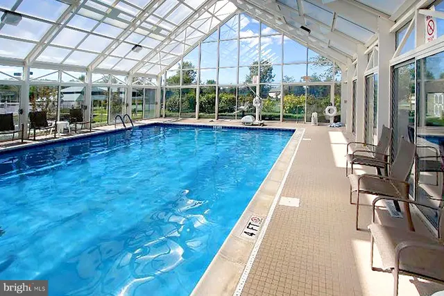 a view of swimming pool with outdoor seating