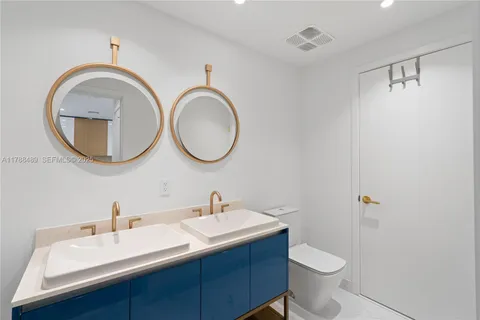 a view of a bathroom with tub and shower