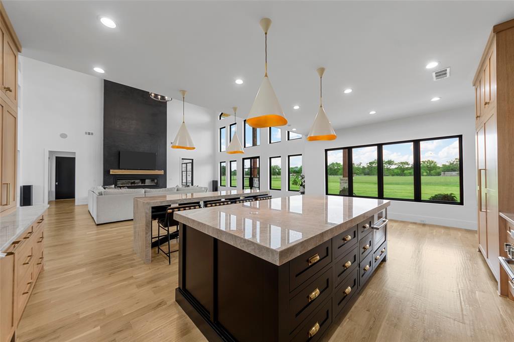 1088 Smith Oak Road Sherman, TX 75090 - Photo 39 of 39 a large kitchen with kitchen island a large island in it