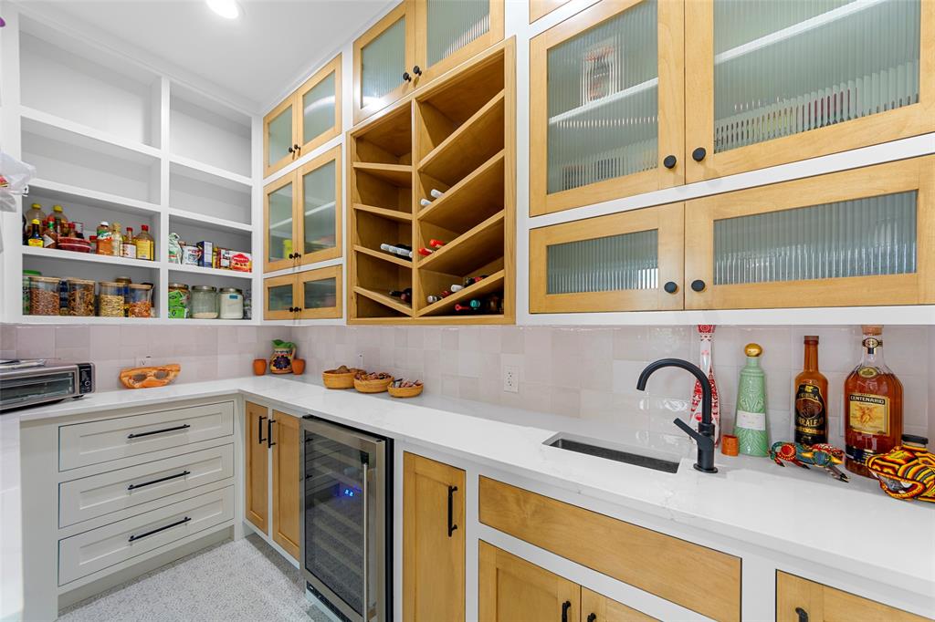 1088 Smith Oak Road Sherman, TX 75090 - Photo 16 of 39 a view of a kitchen with a sink and cabinets