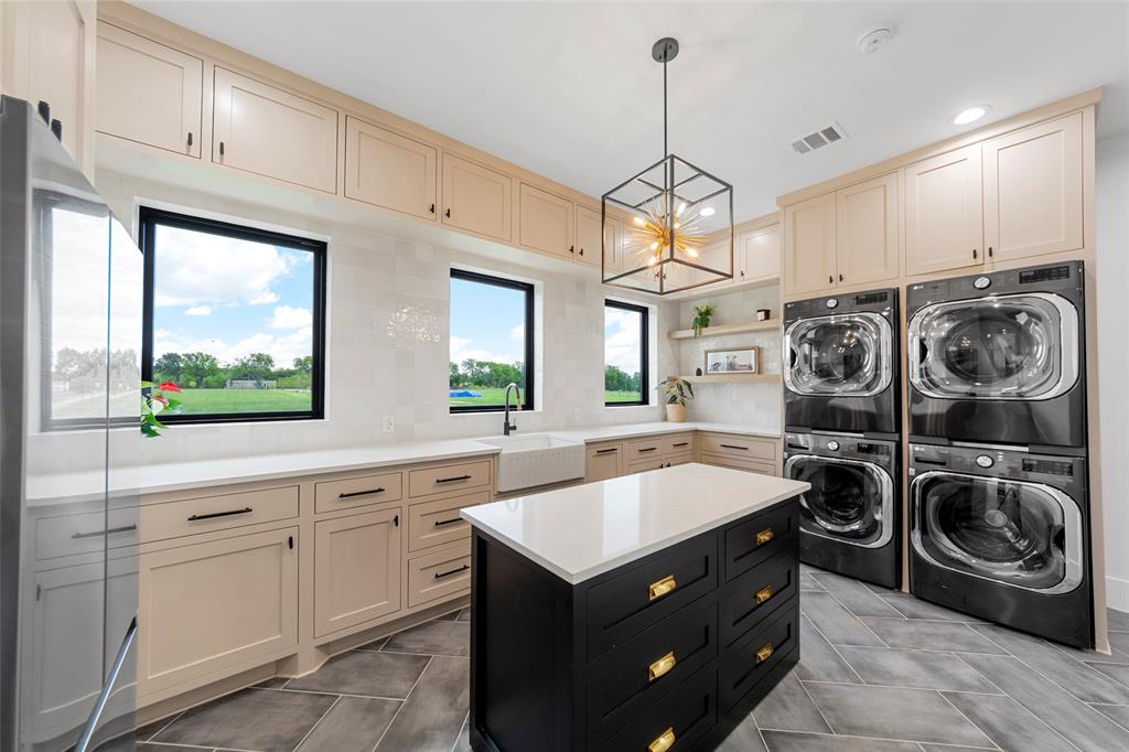 1088 Smith Oak Road Sherman, TX 75090 - Photo 17 of 39 a kitchen with a sink stove top oven and cabinets