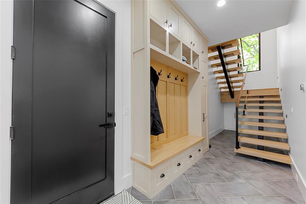 1088 Smith Oak Road Sherman, TX 75090 - Photo 19 of 39 a view of entryway with stairs and wooden floor