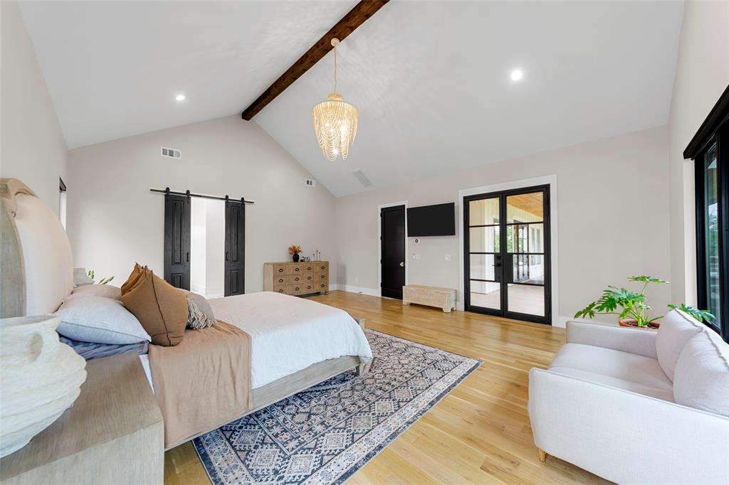 1088 Smith Oak Road Sherman, TX 75090 - Photo 22 of 39 a bedroom with a large bed and a couch