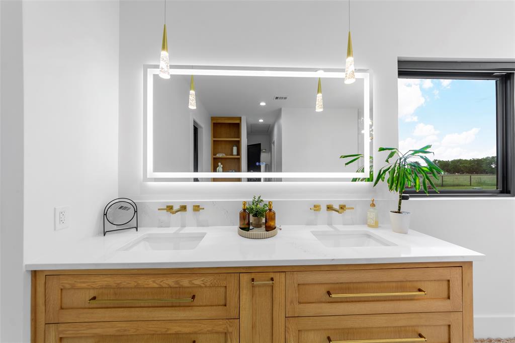 1088 Smith Oak Road Sherman, TX 75090 - Photo 25 of 39 a bathroom with a sink and a mirror