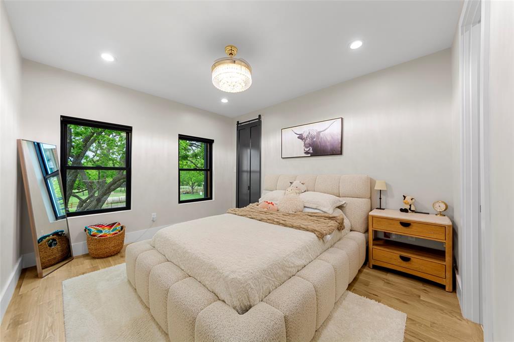 1088 Smith Oak Road Sherman, TX 75090 - Photo 29 of 39 a bedroom with bed and a large window