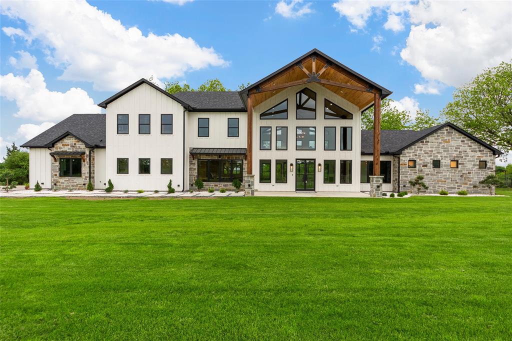 1088 Smith Oak Road Sherman, TX 75090 - Photo 3 of 39 a view of a house with a big yard with large trees