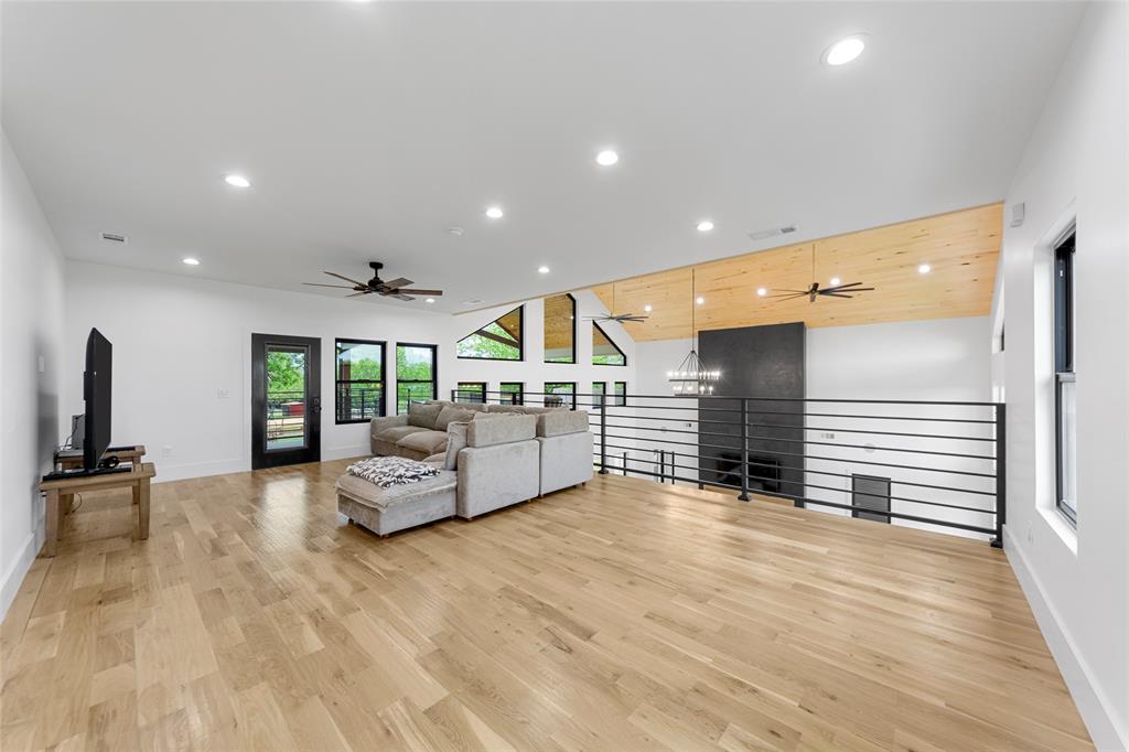 1088 Smith Oak Road Sherman, TX 75090 - Photo 34 of 39 a spacious bedroom with a large bed and a large window