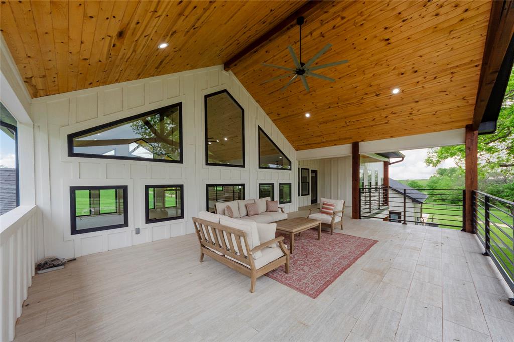 1088 Smith Oak Road Sherman, TX 75090 - Photo 5 of 39 a spacious bedroom with a bed and a large window