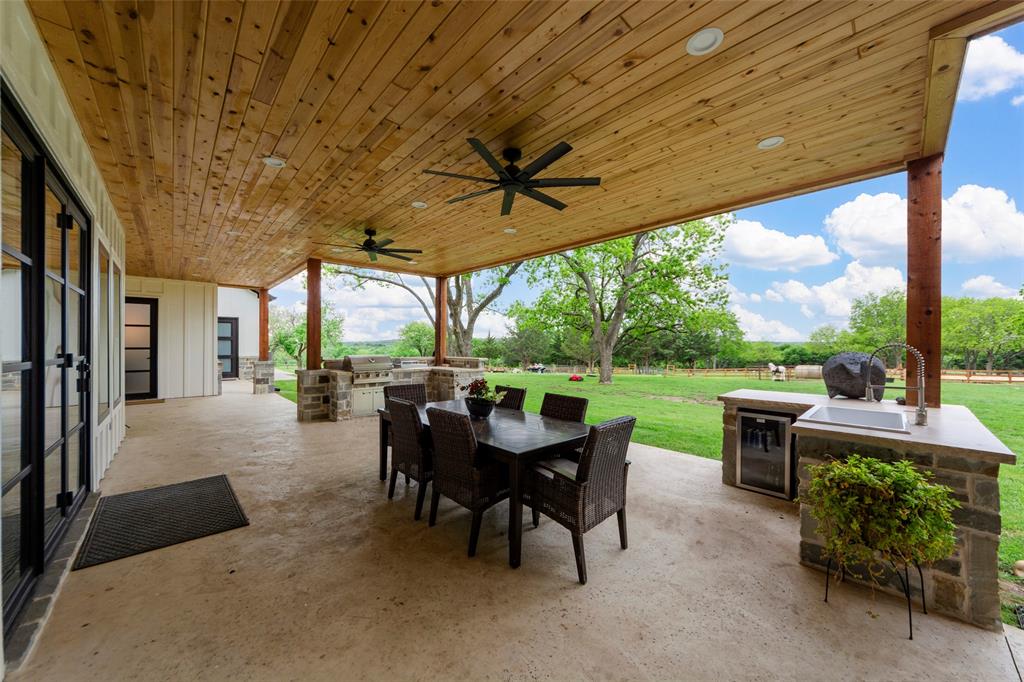 1088 Smith Oak Road Sherman, TX 75090 - Photo 6 of 39 a view of a patio with a table chairs and a backyard