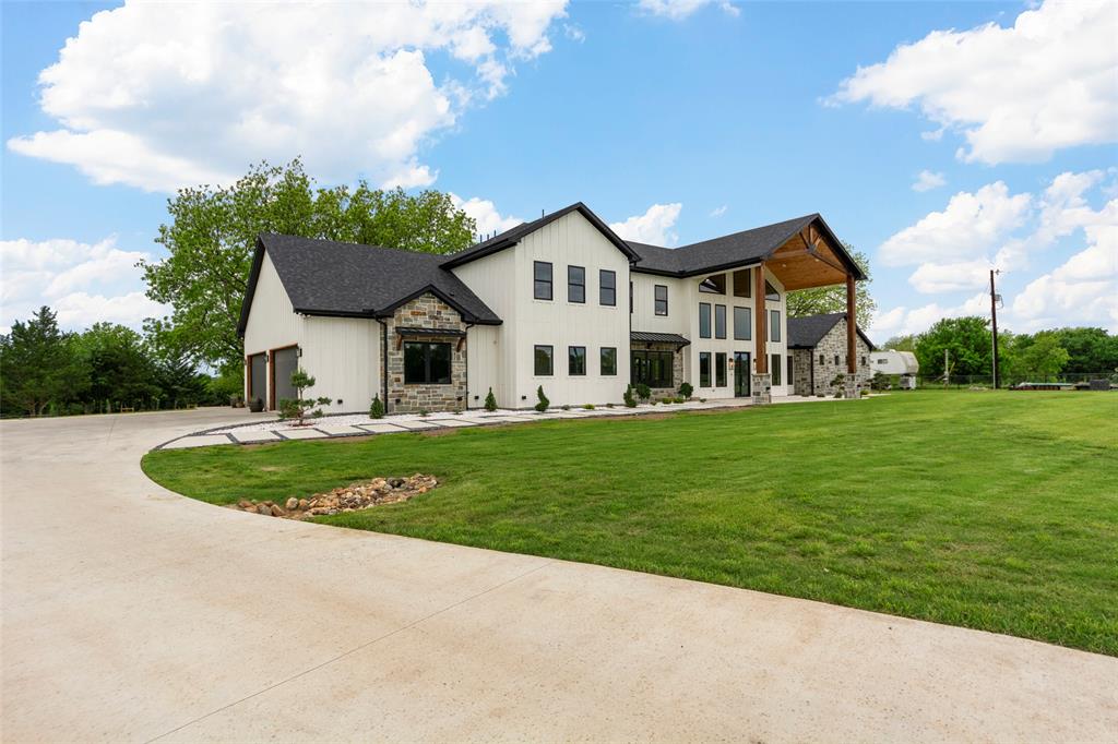 1088 Smith Oak Road Sherman, TX 75090 - Photo 8 of 39 a house view with a garden space