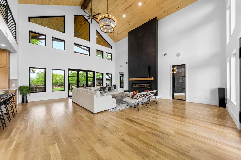 1088 Smith Oak Road Sherman, TX 75090 - Photo 9 of 39 a view of a patio with dining table and chairs with wooden floor and fence