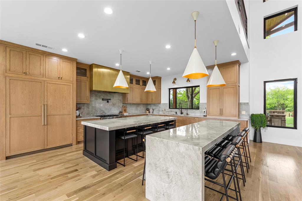 1088 Smith Oak Road Sherman, TX 75090 - Photo 10 of 39 a kitchen with stainless steel appliances granite countertop a stove a sink and a microwave