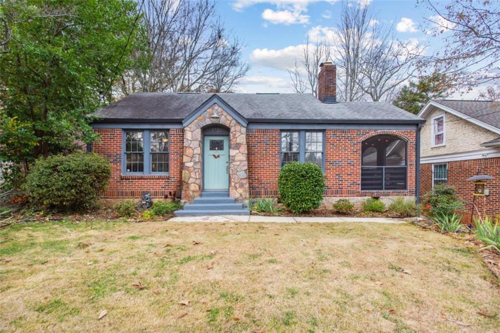 1733 Sylvan Road Southwest Atlanta, GA 30310 - Photo 1 of 1 a front view of a house with garden