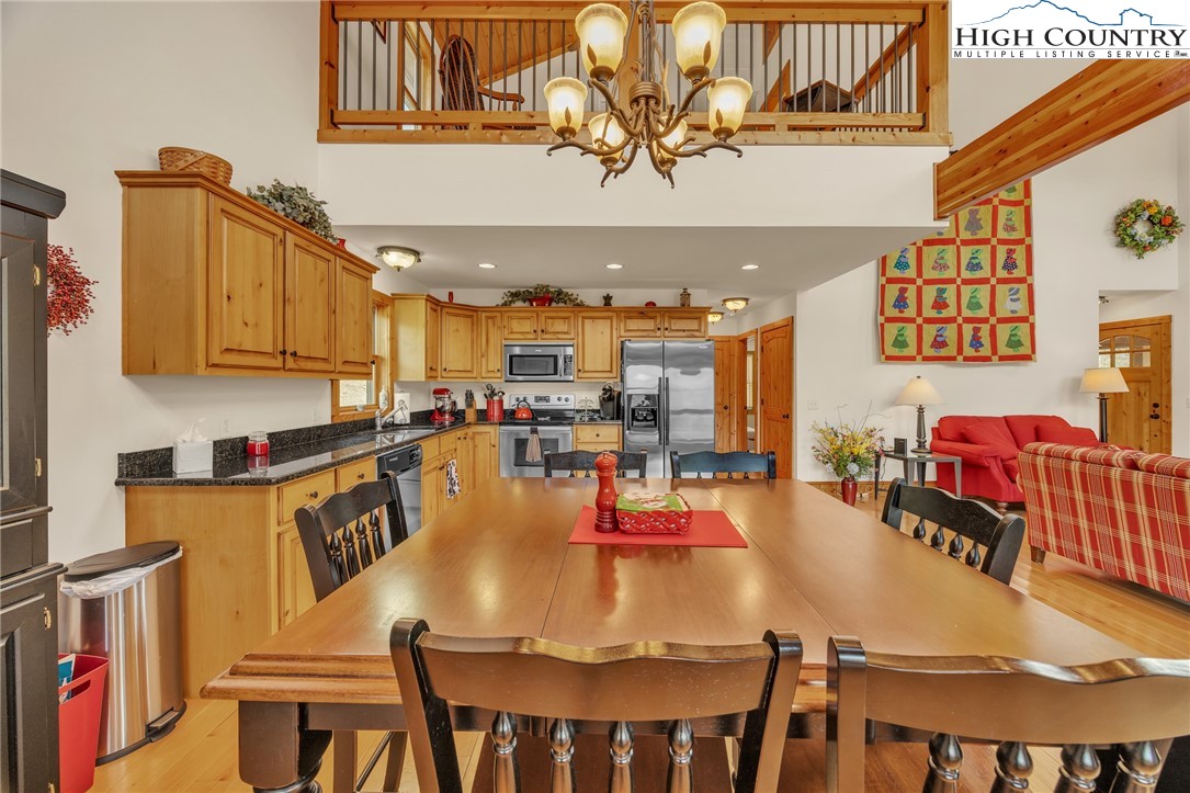 1118 Lucy Bell Road Crumpler, NC 28617 - Photo 11 of 39 a view of a dining room with furniture