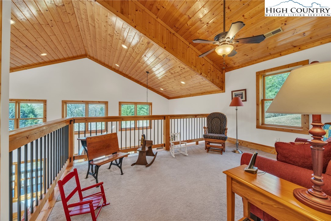 1118 Lucy Bell Road Crumpler, NC 28617 - Photo 19 of 39 a living room with furniture and a flat screen tv