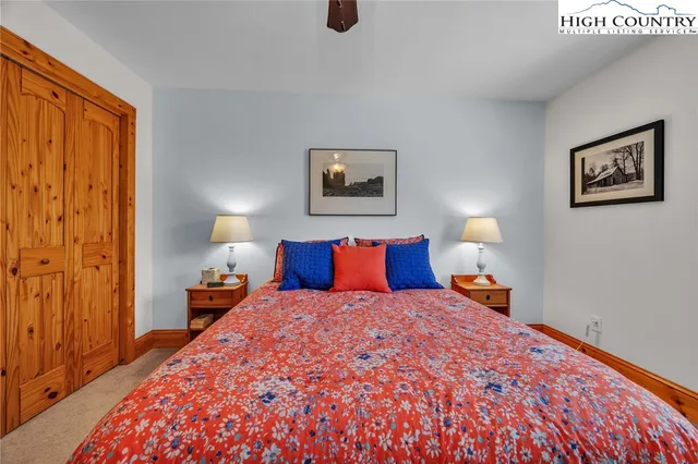 a bedroom with bed and window